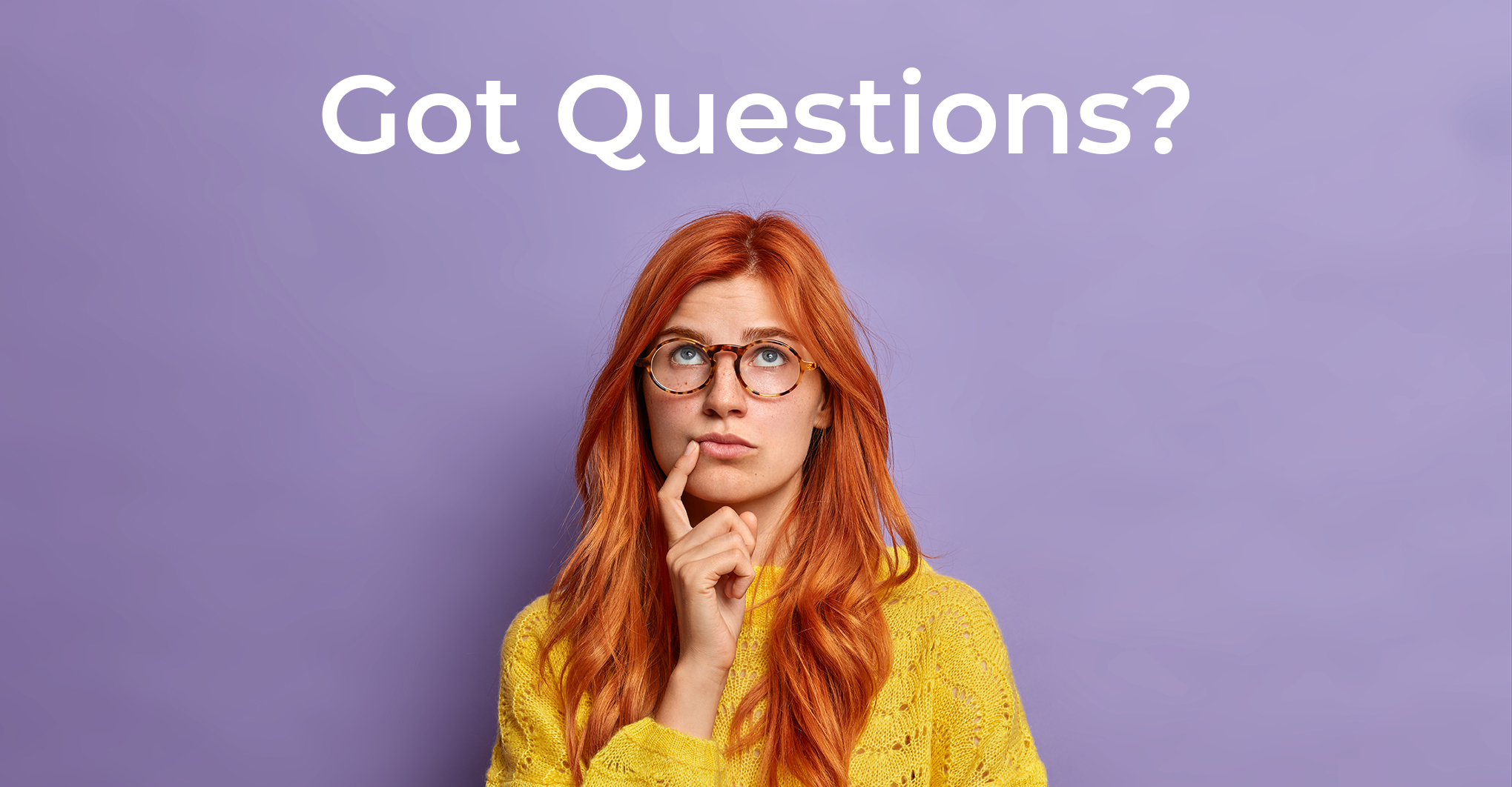 Vertical shot of young European woman in glasses with natural red hair stands in thoughtful pose tries to choose something or thinks about future concentrated above poses against purple background